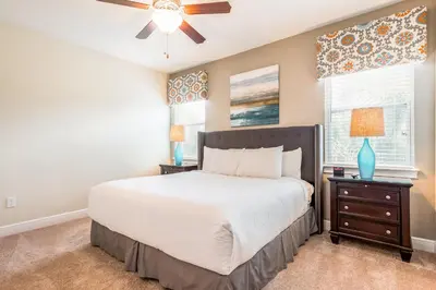 a bedroom with a bed and a ceiling fan at Vibrant Home Near Disney With Private Pool, Themed Rooms And Waterpark & Resort Access At Encore Resorts Reunion - 401No in Kissimmee