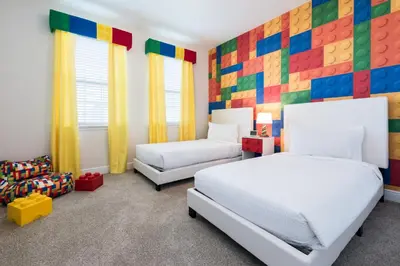a bedroom with two beds and a colorful wall at Grand Home Near Disney With Private Pool, Media And Themed Rooms With Waterpark & Resort Access At Encore Resorts Reunion - 360Bu in Kissimmee