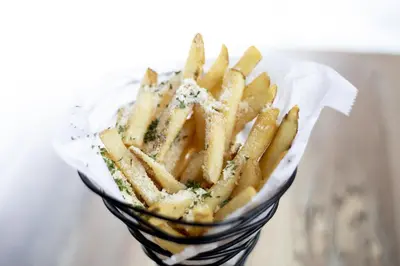 a pile of french fries in a glass bowl at Hyatt House across from Universal Orlando Resort in Orlando