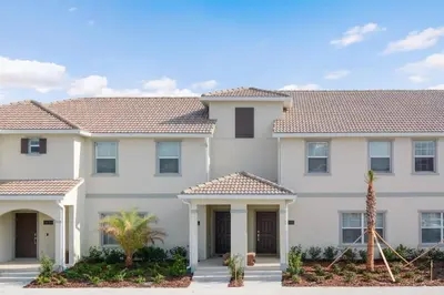 a large white house with tile roofs at Four Bedrooms close to Disney w Pool 4898 in Kissimmee