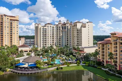 an aerial view of a resort with a pool and buildings at Wyndham Grand Orlando Resort Bonnet Creek in Orlando