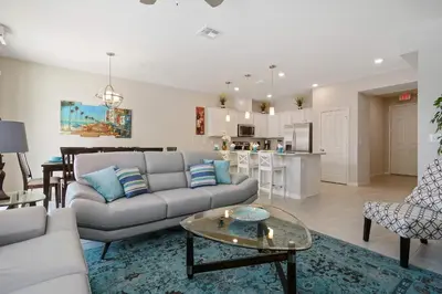 a living room with a couch and a table at Four Bedroom w/ GameRoom 5152A in Kissimmee