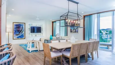 a dining room with a table and chairs at Margaritaville Resort Orlando with H2O Waterpark in Kissimmee