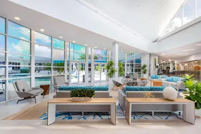 a living room with a pool and glass walls at Holiday Inn Resort Kissimmee by the Parks by IHG in Orlando