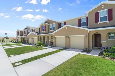 a large house with a driveway at Four Bedroom with GameRoom 5150A in Kissimmee