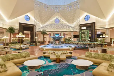 a lobby with a large fountain in the middle at Walt Disney World Dolphin in Orlando
