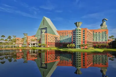 a rendering of a resort with its reflection in the water at Walt Disney World Dolphin in Orlando
