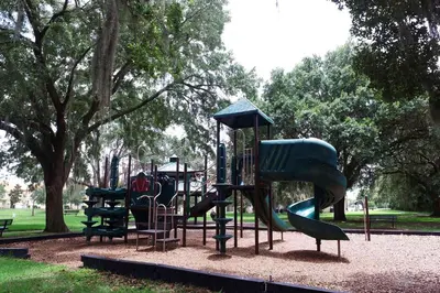 a playground with a slide in a park at 4Bd Sleeps 9 w Jacuzzi Close to Disney @ Compass Bay 5113C in Kissimmee