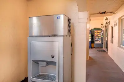 a refrigerator with its door open in a room at Red Roof Inn Orlando South - Florida Mall in Orlando