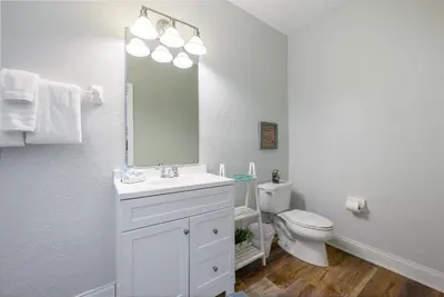 a white bathroom with a sink and a toilet at Tideview Circle Unit 38 Condo in Orlando