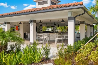 a pavilion with a table and chairs on a patio at Tideview Circle Avenue Unit 59 Condo in Orlando