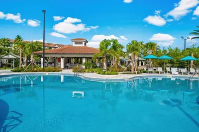 a large blue swimming pool in front of a resort at Tideview Circle Avenue Unit 59 Condo in Orlando