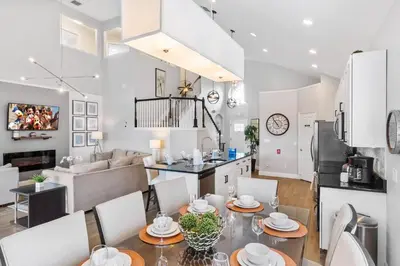 a kitchen and living room with a table and chairs at Sun Palm 8119 in Kissimmee