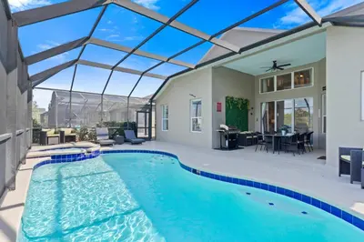 a swimming pool in a house with a glass ceiling at Sun Palm 8119 in Kissimmee