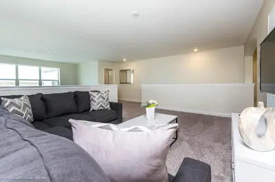 a living room with a couch and a table at Beautiful Home wPrivate Pool & Spa, near WDW in Kissimmee