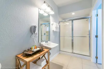 a bathroom with a sink and a shower at Lovely Townhome at Vista Cay Resort near WDW in Orlando