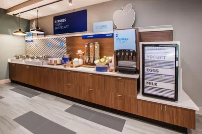 an apple store with a counter with an appleasteryasteryasteryasteryasteryasteryastery at Holiday Inn Express & Suites Orlando- Lake Buena Vista by IHG in Orlando