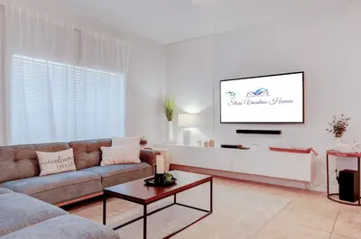 a living room with a couch and a table at 8937CP-SVH in Kissimmee