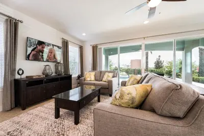 a living room with a couch and a table at Private Pool And Game Room With Waterpark & Resort Access At Encore Resorts Reunion - 141La in Kissimmee