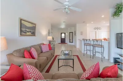 a living room with a couch and a table at Holiday Villas of Kissimmee in Kissimmee