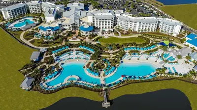 an aerial view of a resort with a pool at Margaritaville Cottages Orlando by Rentyl with H2O Waterpark in Kissimmee