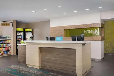 a lobby with a counter in a store at Home2 Suites By Hilton Clermont in Clermont