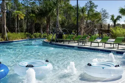a swimming pool with two water fountains in a resort at Storey Lake Resort Just 5 Minutes to Mickey Mouse in Kissimmee