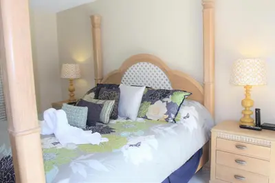 a bedroom with a canopy bed with pillows at Crayson Villa LF811 in Kissimmee