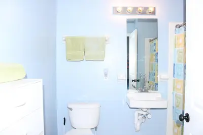 a white bathroom with a toilet and a sink at Crayson Villa LF811 in Kissimmee