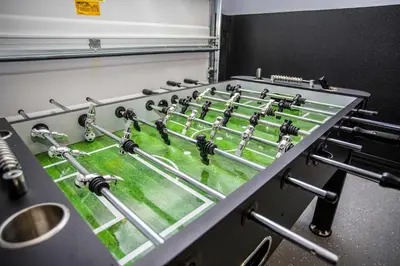 a machine with a football field in a room at Four Bedroom Close to Disney 5149A in Kissimmee