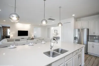 a kitchen with a sink and a counter top at Sonoma Resort 7 Bedroom Home with Pool 1849 in Kissimmee