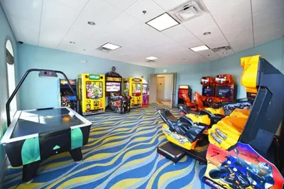a room with many arcade games and a video game room at DWS Vacation Villas in Orlando