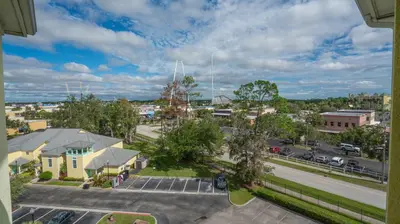 an aerial view of a city with a parking lot at Barefoot Suite in Orlando