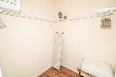 a room with a bed and shelves on the wall at Dream Vacation Home! in Kissimmee