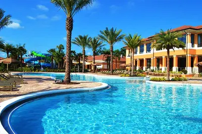 a swimming pool at a resort with palm trees at Scarlet in Orlando