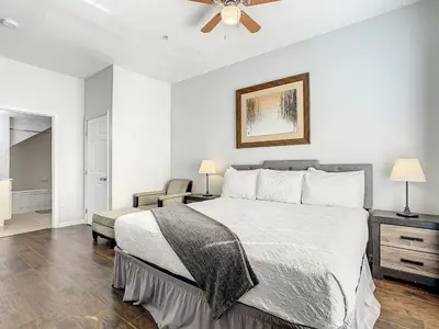 a bedroom with a bed and a ceiling fan at 4 Bedroom Townhouse in a Gated Resort! in Kissimmee