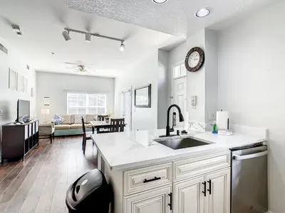 a kitchen with a sink and a counter top at 4 Bedroom Townhouse in a Gated Resort! in Kissimmee