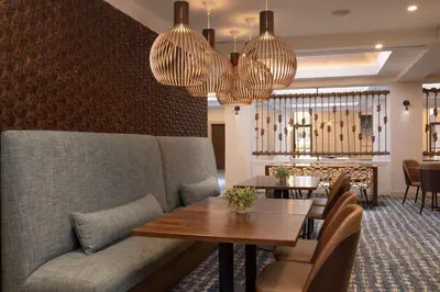 a living room with a couch and a table at DoubleTree Suites by Hilton Orlando at Disney Springs in Orlando