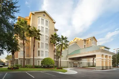 a rendering of a hotel with a parking lot at Homewood Suites by Hilton Orlando-International Drive Convention Center in Orlando