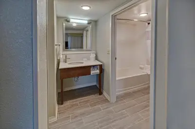 a bathroom with a sink and a shower at Hampton Inn & Suites Clermont in Clermont