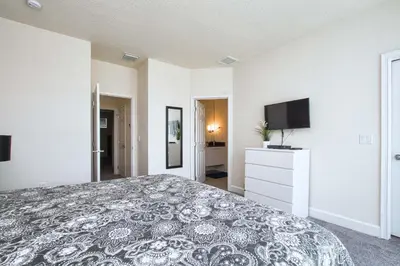 a large bedroom with a bed and a tv at Silver Creek - 3 Bed Townhouse Wsplashpool-5003Sc in Orlando