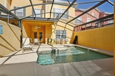 a swimming pool in the middle of a building at Paradise Palms-4 Bed Townhome W-Splashpool-3044Ppr in Kissimmee