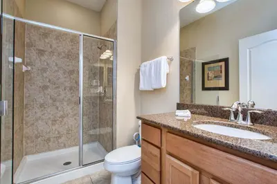 a bathroom with a shower and a toilet and a sink at Paradise Palms-4 Bed Townhome W-Splashpool-3044Ppr in Kissimmee