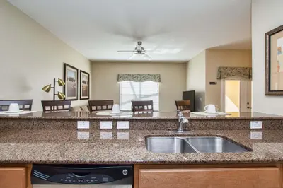 a kitchen with a sink and a counter top at Paradise Palms-4 Bed Townhome W-Splashpool-3044Ppr in Kissimmee