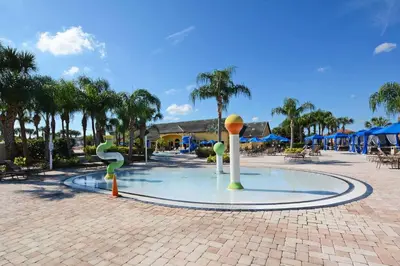 a fountain in the middle of a courtyard with trees at Dog-Friendly Townhome Wsplashpool -3201Pp in Kissimmee