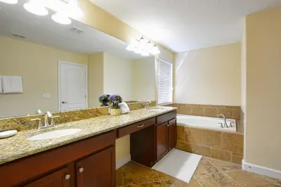 a bathroom with a sink and a bath tub at Very Private Pool & Spa, Spacious, Wifi - 3507Pp in Kissimmee