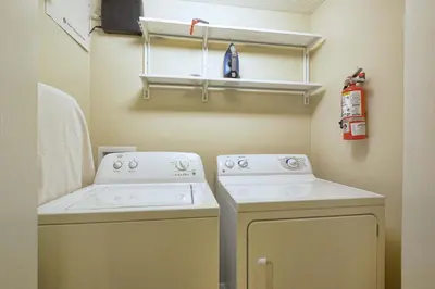 a laundry room with a washer and dryer at Paradise Palms-4 Bed Townhome W-Splashpool-3035Pp in Kissimmee