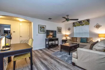 a living room with a couch and a table at Conservation View, Resort, Pool Home-3116Pp in Kissimmee