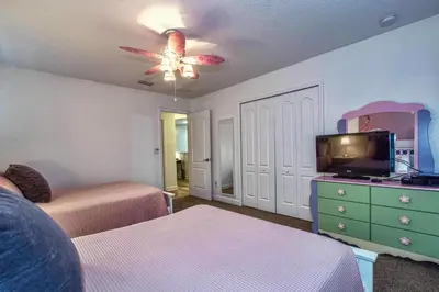 a bedroom with two beds and a ceiling fan at Conservation View, Resort, Pool Home-3116Pp in Kissimmee