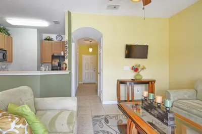 a living room with two couches and a kitchen at Encantada -4 Bedroom Townhome W- Splashpool-2651En in Kissimmee